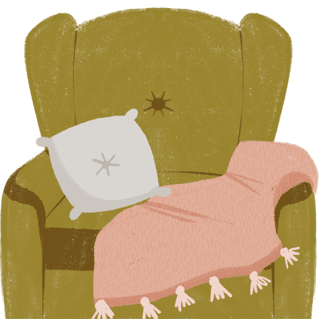 Sofá con cojines y manta